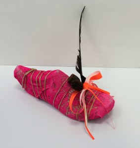Impossible shoe 1. 2014. Cardboard, lace, paper covered wire, feather, gum nuts, fluoro material.